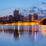 Panoramic image of St. Louis downtown with Gateway Arch at twilight.