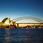 Sydney, Australia — April 13th, 2012 : Sydney opera house and Sydney Harbour bridge taken at nite. if you watch carefully,there is star constelation above the bridge