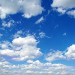 blue sky background with tiny clouds